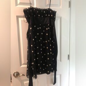 Black w/ cream polka dots. Empire waist w/ satin sash that ties in back.